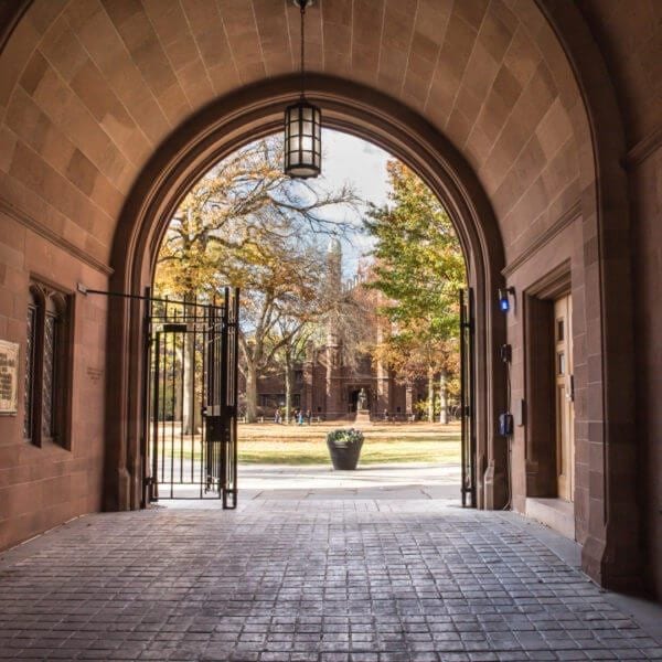 Phelps Gate at Yale University looking in towards the campus with people visible in the distance.