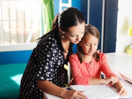 mother and daughter doing homework together