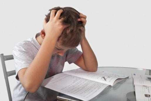 Teenage boy thinking about homework