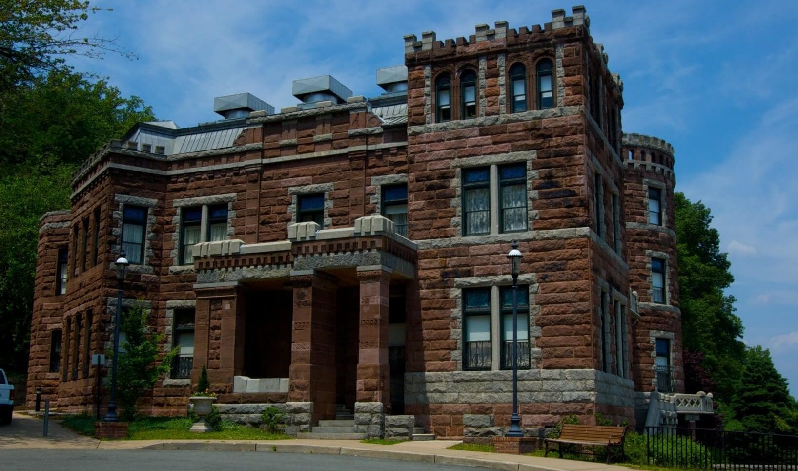 large red stone home styled like a castle
