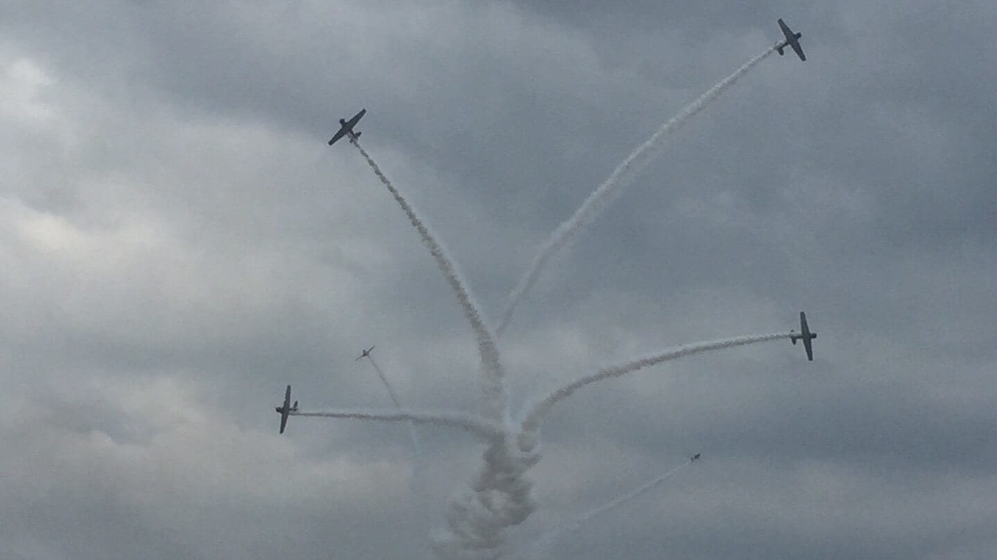 four planes performng aerial stunts
