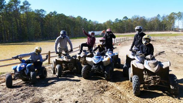 Guys riding ATVs