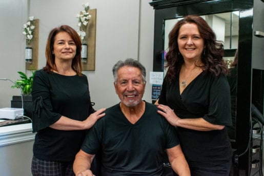 group photo of hair plus owners
