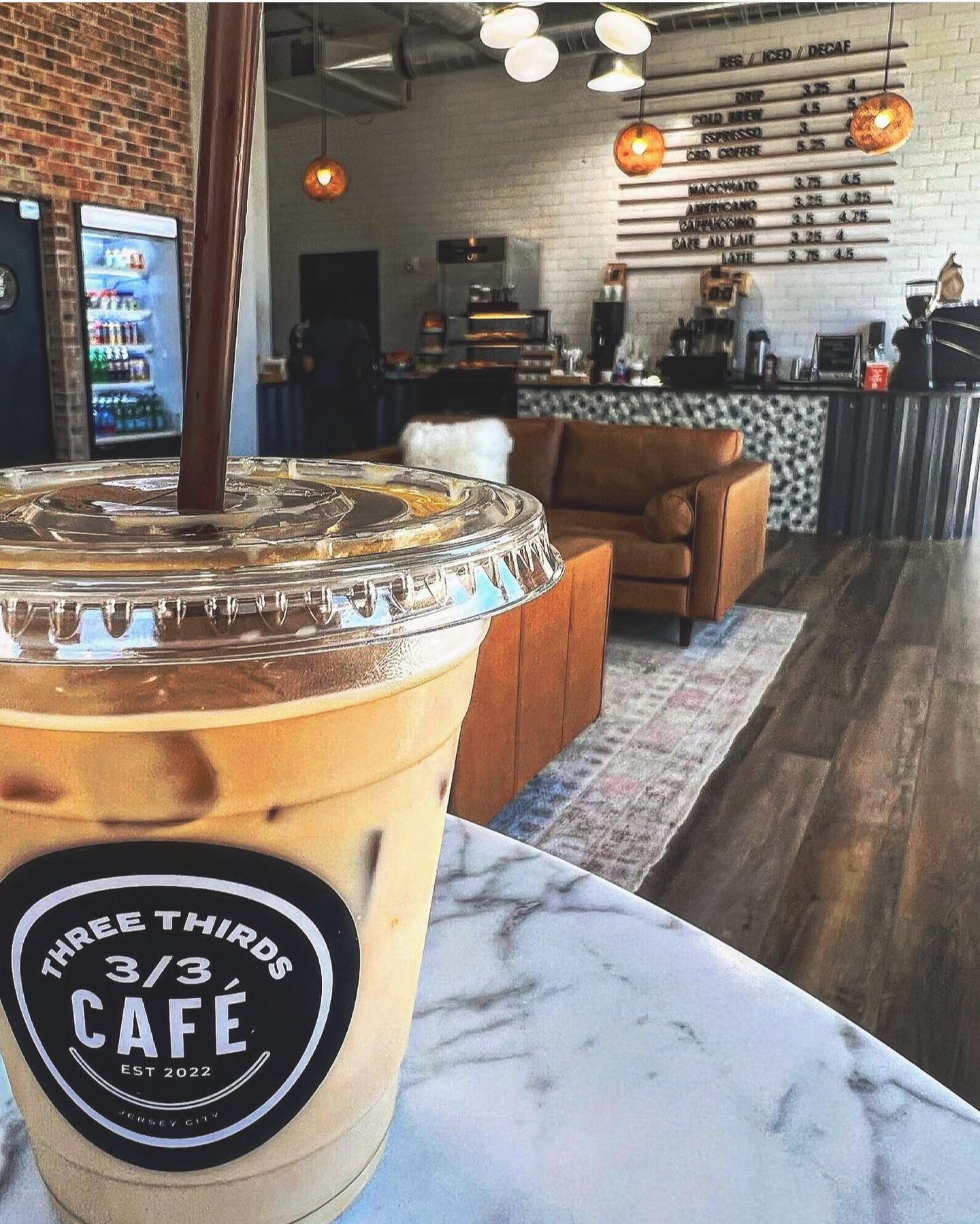 Iced Latte and Three Thirds Cafe Interior