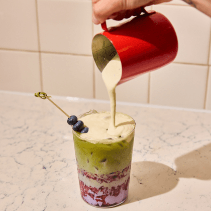 Pouring Milk into gourmet coffee